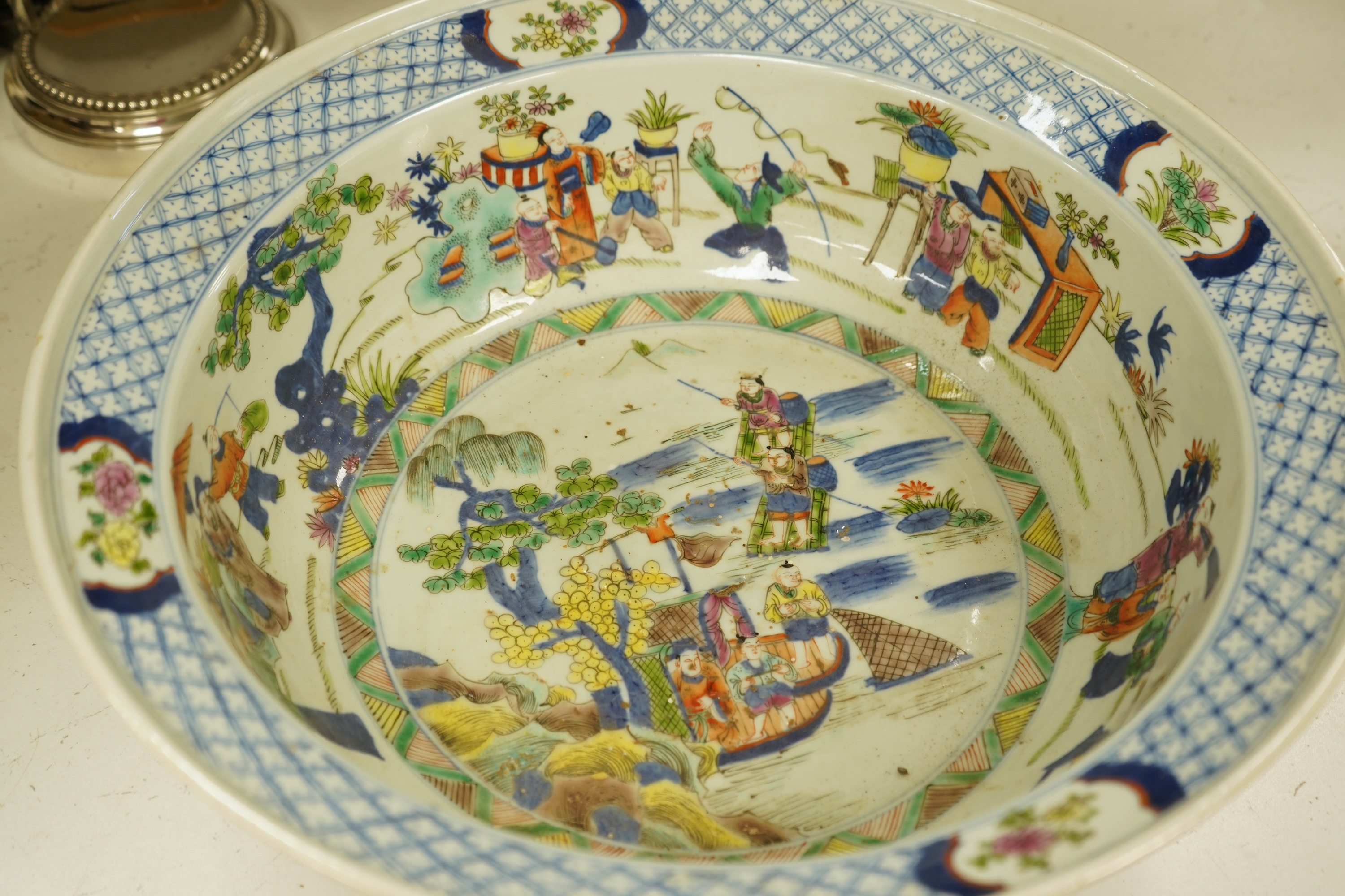A large Chinese porcelain basin enamelled with figures, 41cm in diameter